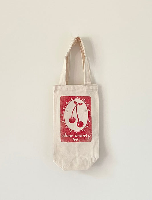Wine tote bag.  Off white cotton canvas with red print of cherries and the words, Door County, WI.